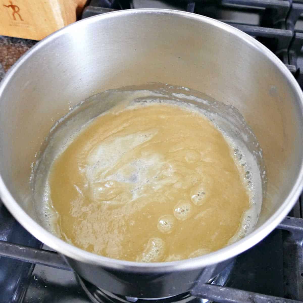 flour and butter cooking for the base of a roux in a saucepan