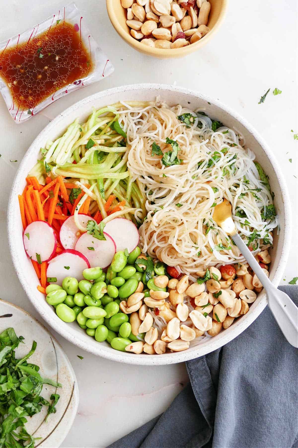 deconstructed spring roll in a bowl with toppings on a counter