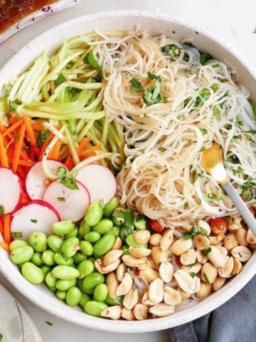 square image of a spring roll bowl with toppings on a counter