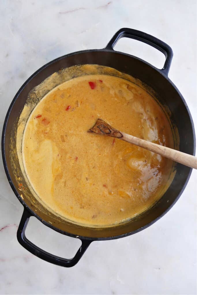 coconut milk peanut butter broth for vermicelli soup cooking in a pot