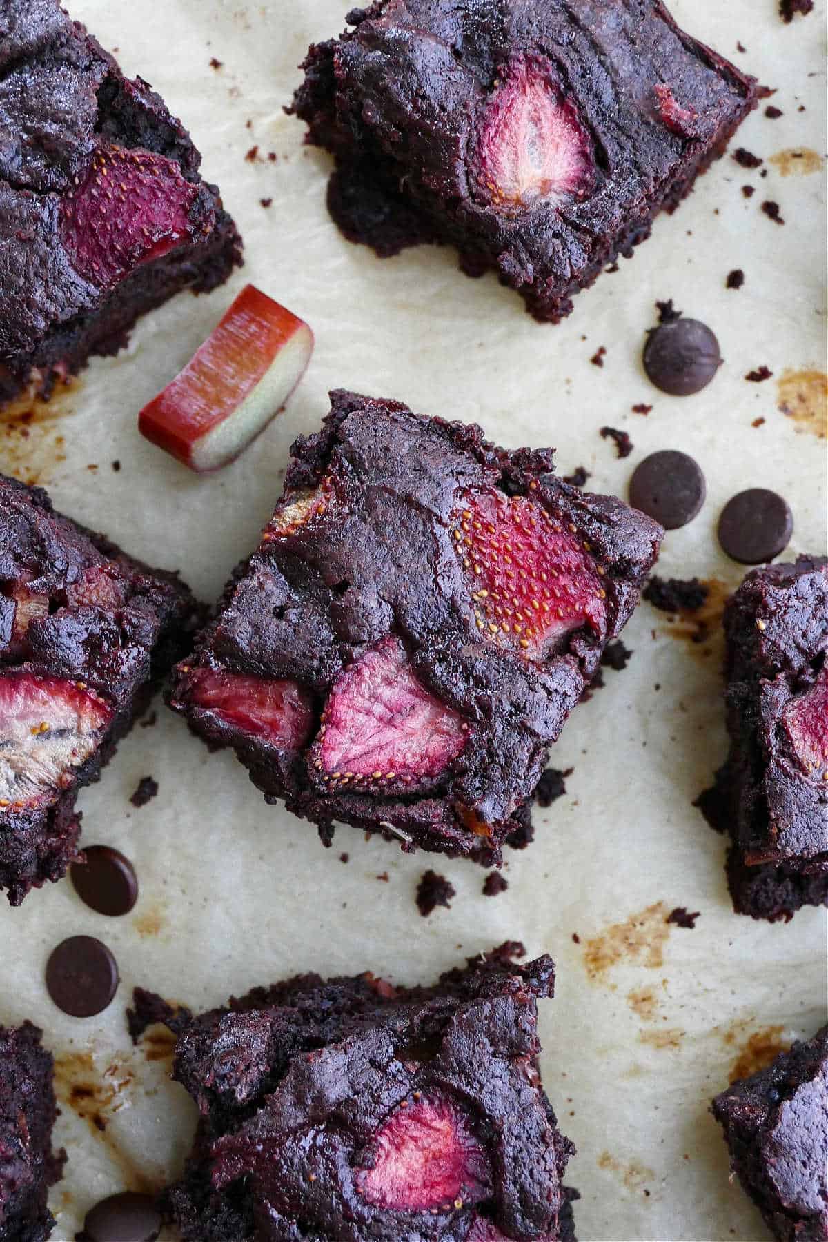 close-up photo of a strawberry rhubarb brownie surrounded by more brownies