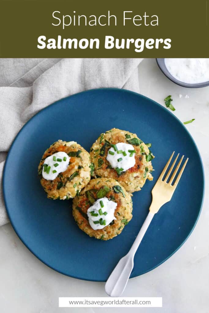 three spinach feta salmon burgers on a serving plate topped with yogurt and chives under text box