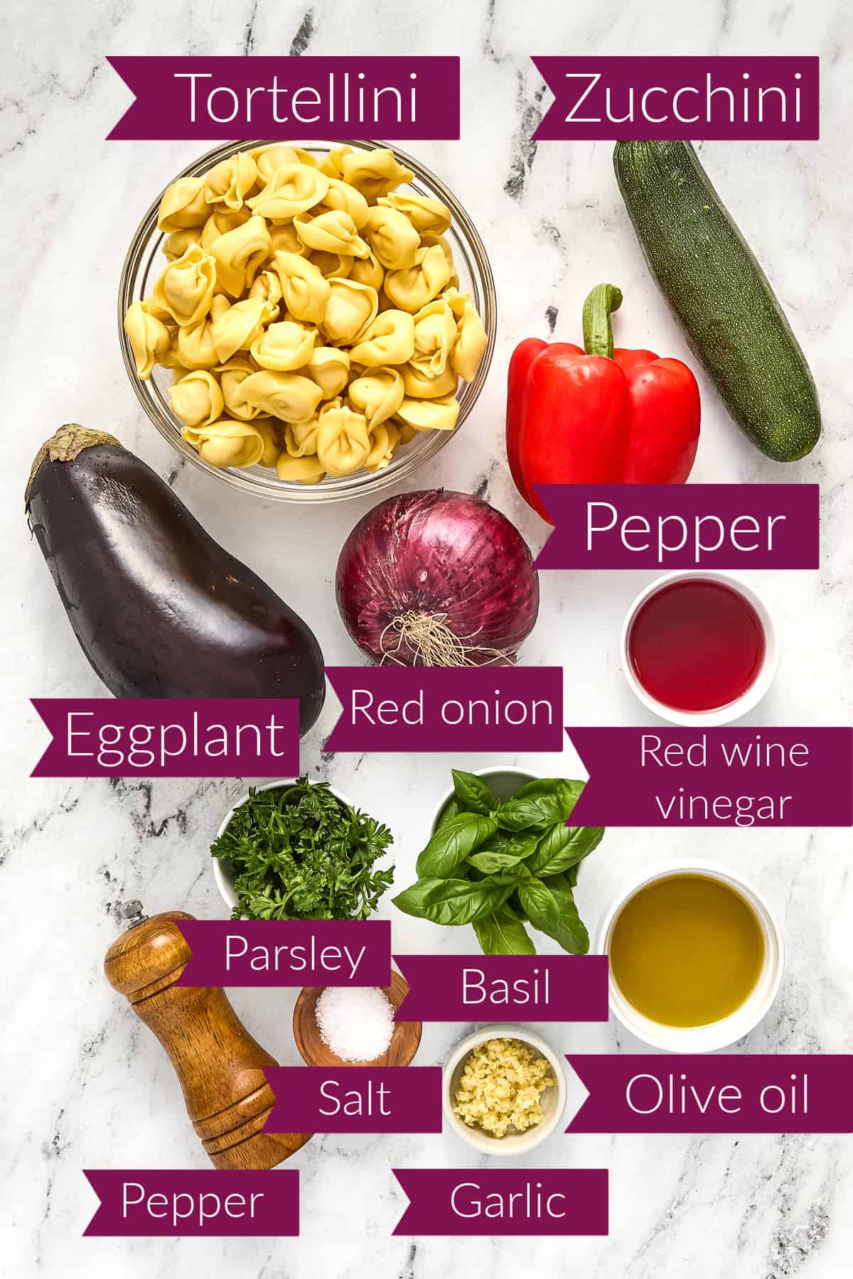 Tortellini, zucchini, pepper, eggplant, red onion, vinegar, parsley, basil, olive oil, pepper, salt, and garlic.