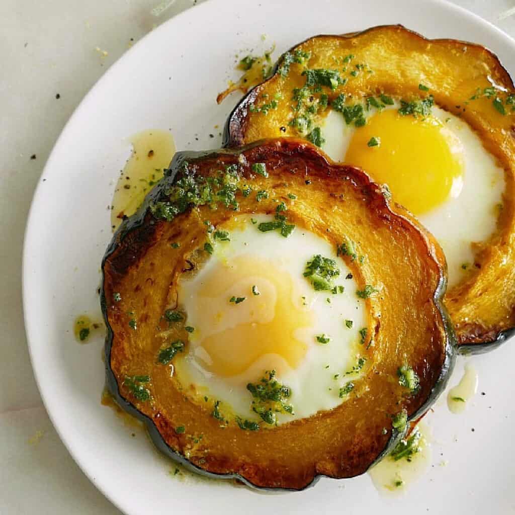 acorn squash eggs-in-a-hole with sage brown butter on a plate