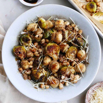 gnocchi, Brussels sprouts, white beans, parmesan, and balsamic reduction in a serving bowl