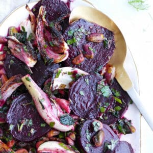 beet fennel salad with herbs and citrus dressing on a serving dish