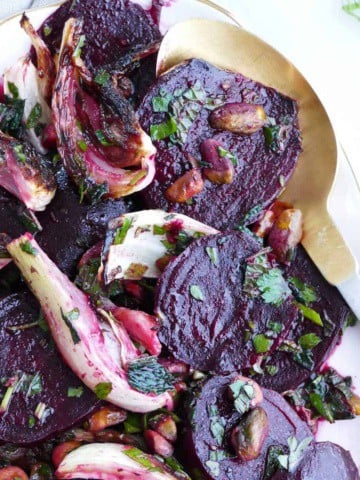 beet fennel salad with herbs and citrus dressing on a serving dish