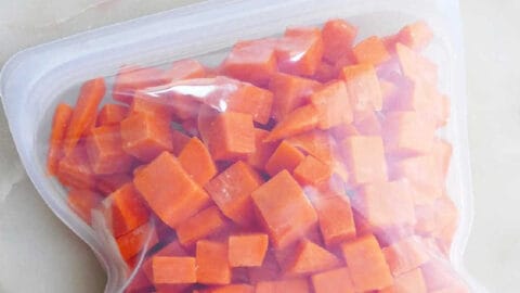 frozen sweet potato cubes in a silicone bag with text box with post title