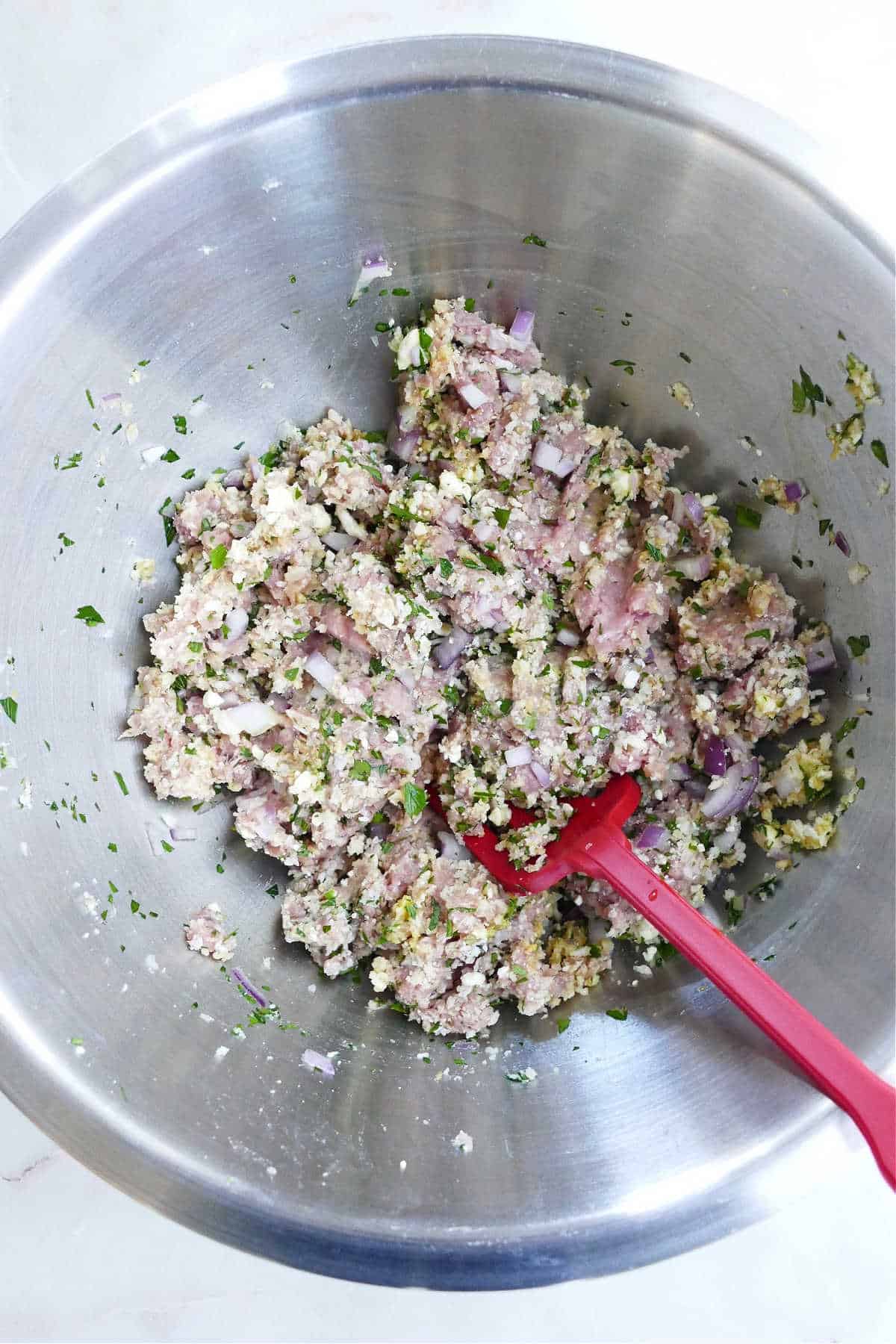 ingredients for Greek turkey meatballs mixed together in a bowl