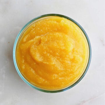 acorn squash puree in a glass bowl on a counter