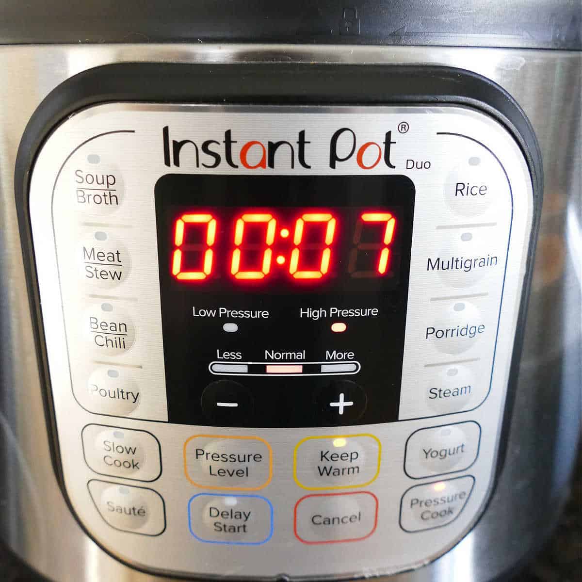 instant pot with timer set to seven minutes
