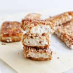 three pieces of crispy tofu stacked on top of each other on parchment