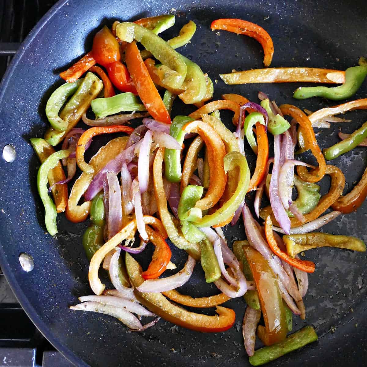 fajita veggies cooking in a skillet