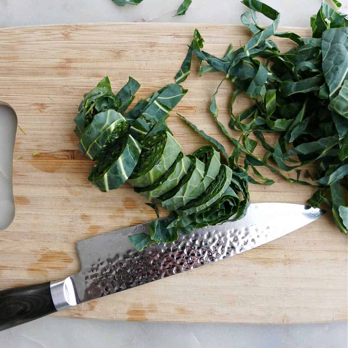 collard greens cut into small pieces on a cutting board