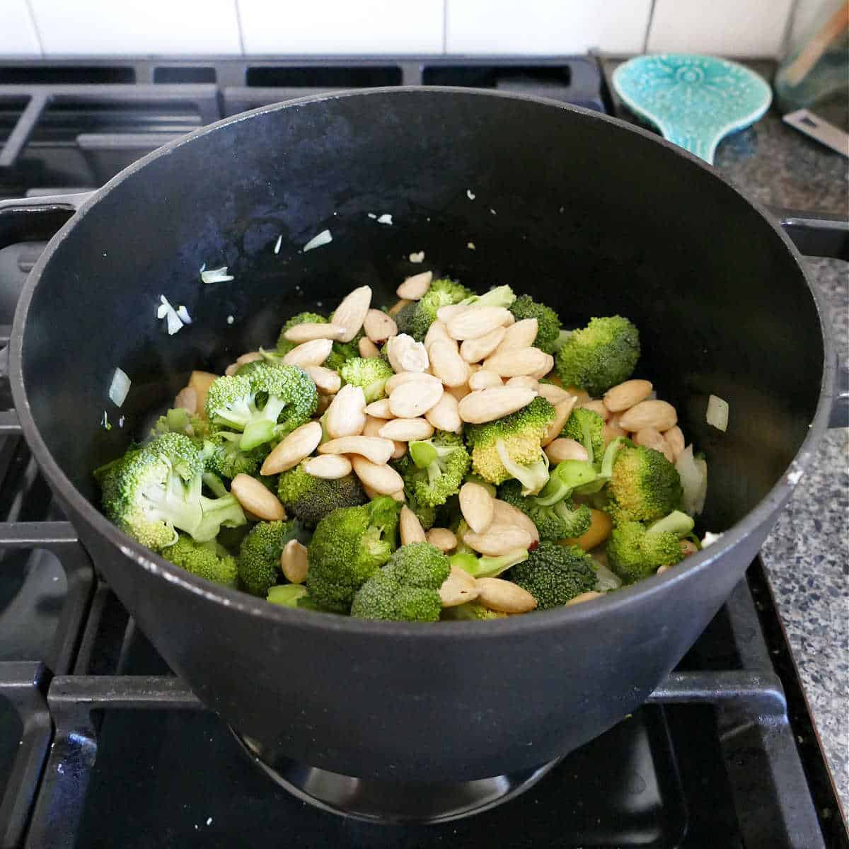 onion, garlic, broccoli, and blanched almonds in a soup pot