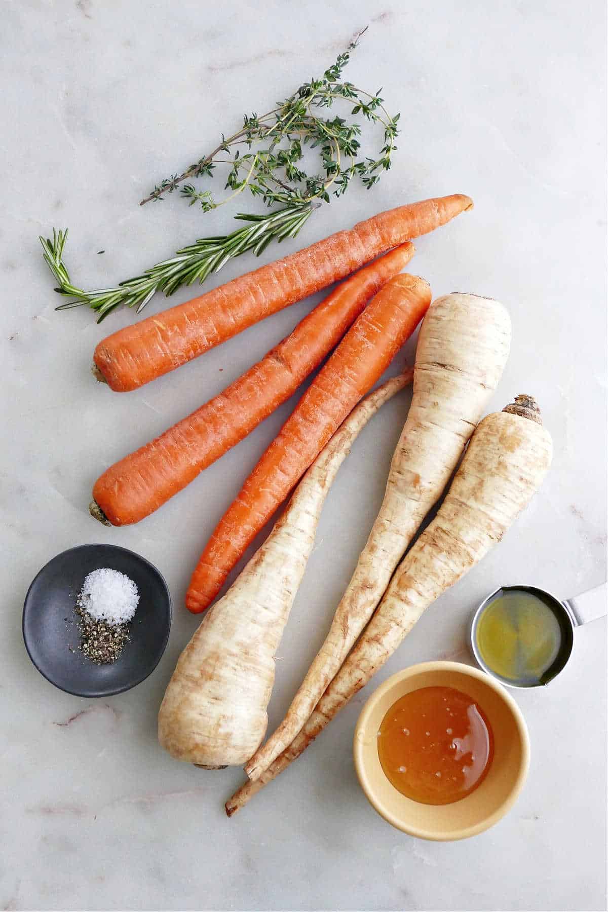 thyme, rosemary, carrots, parsnips, salt, pepper, olive oil, and honey