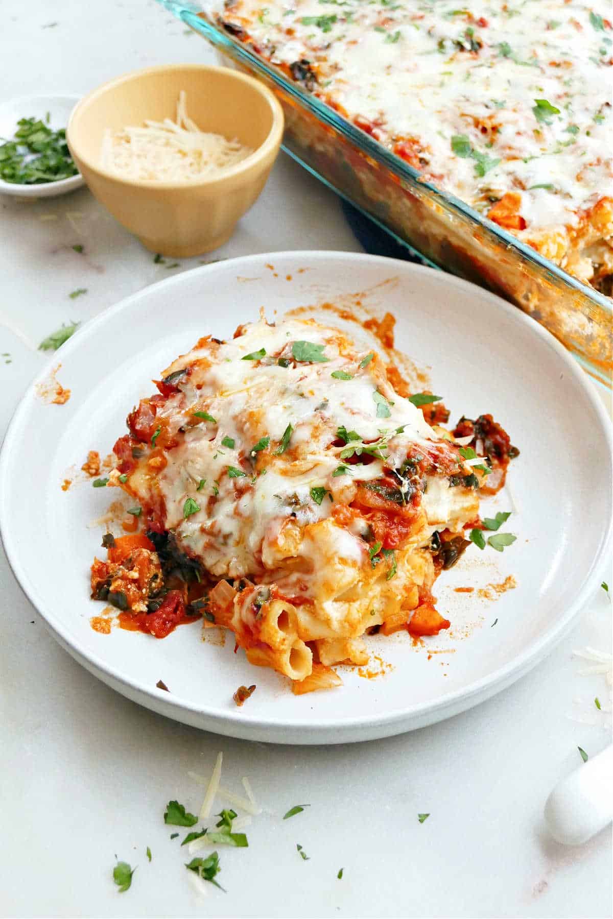 meatless baked ziti with vegetables and parsley on a plate