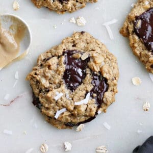 tahini oatmeal cookies with chocolate and coconut on a counter