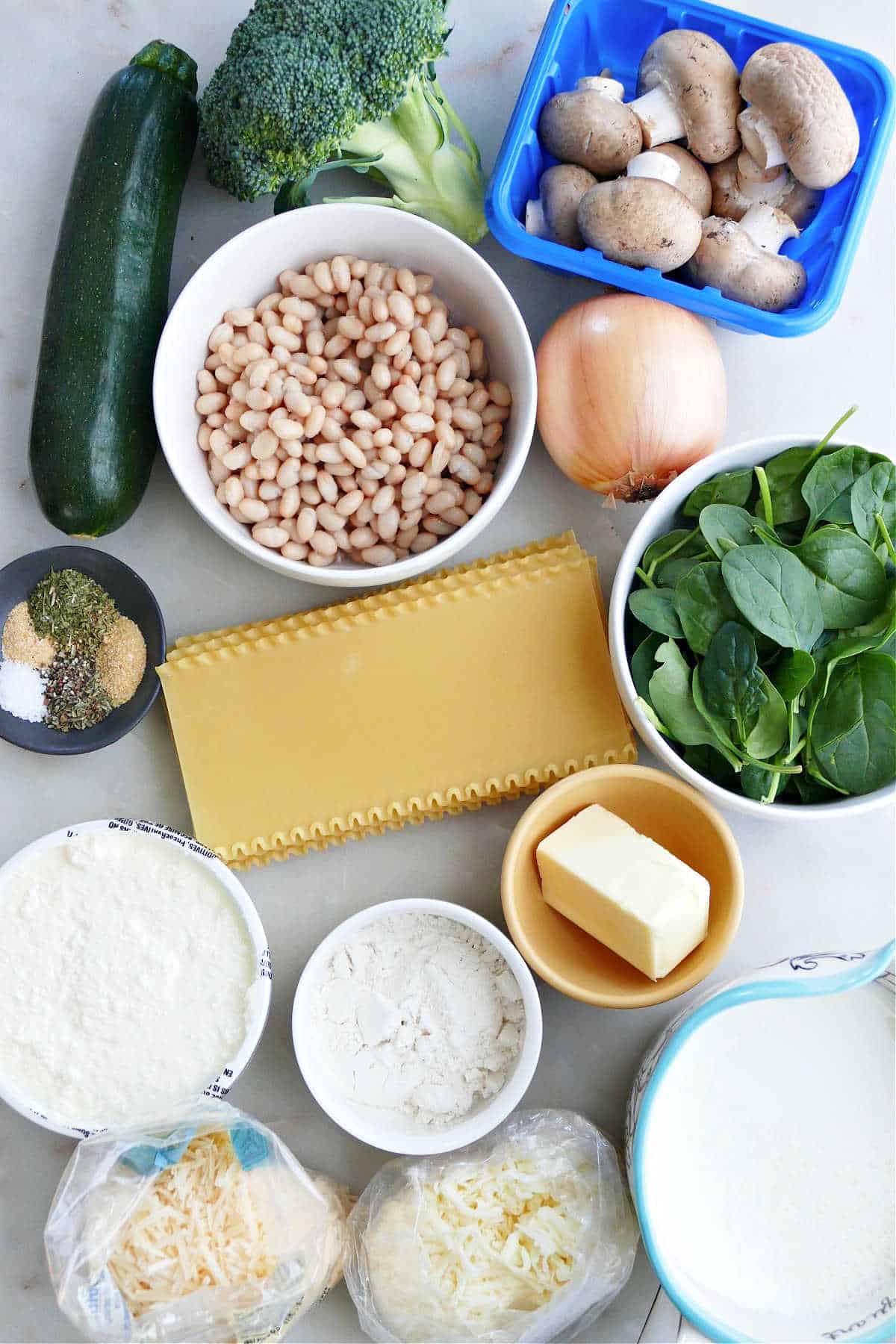 vegetables, beans, seasonings, butter, flour, milk, cheese, and noodles for lasagna