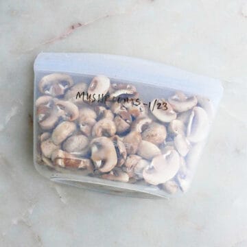 frozen mushrooms in a silicone bag with label on a counter