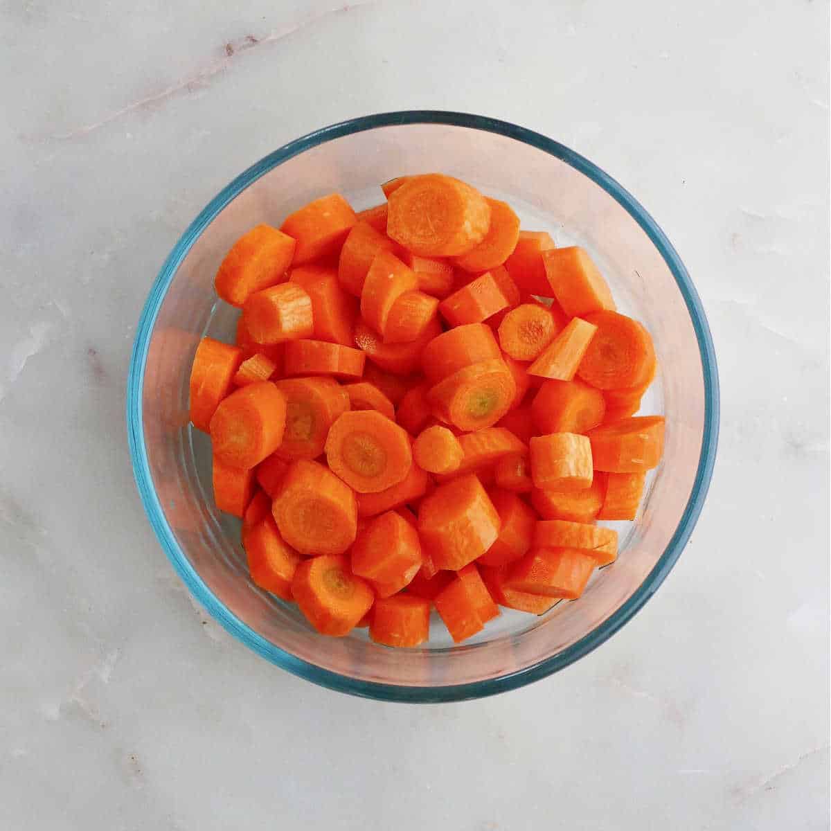 carrots in a bowl with water before being microwaved