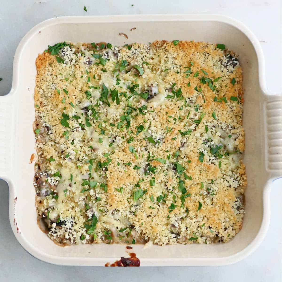 mushroom gratin after baking sprinkled with parsley