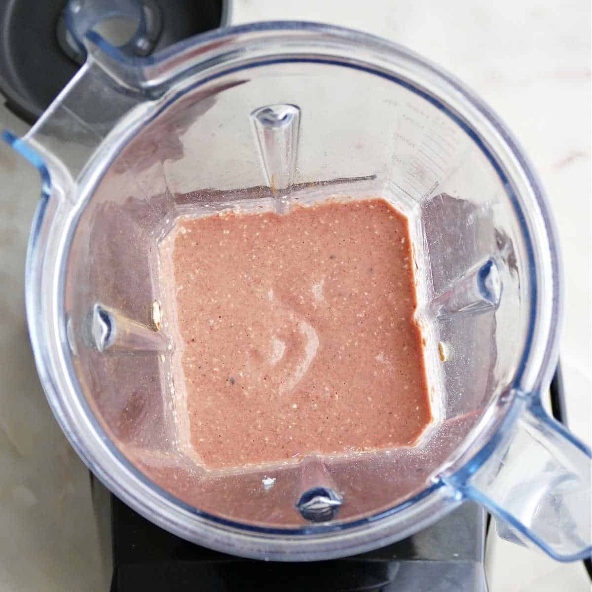 batter for beet pancakes in a blender on a counter