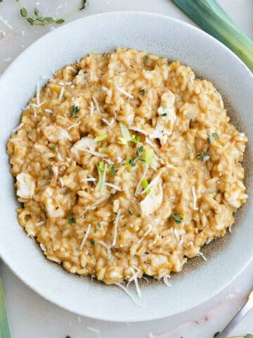 chicken and leek risotto in a serving bowl on a counter