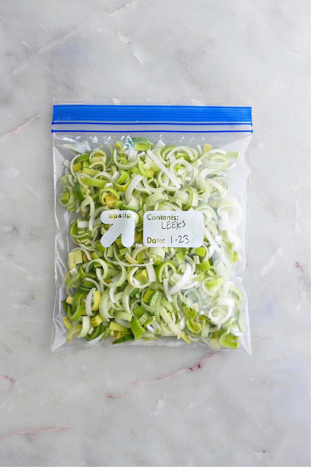 frozen leeks in a labeled, airtight freezer bag