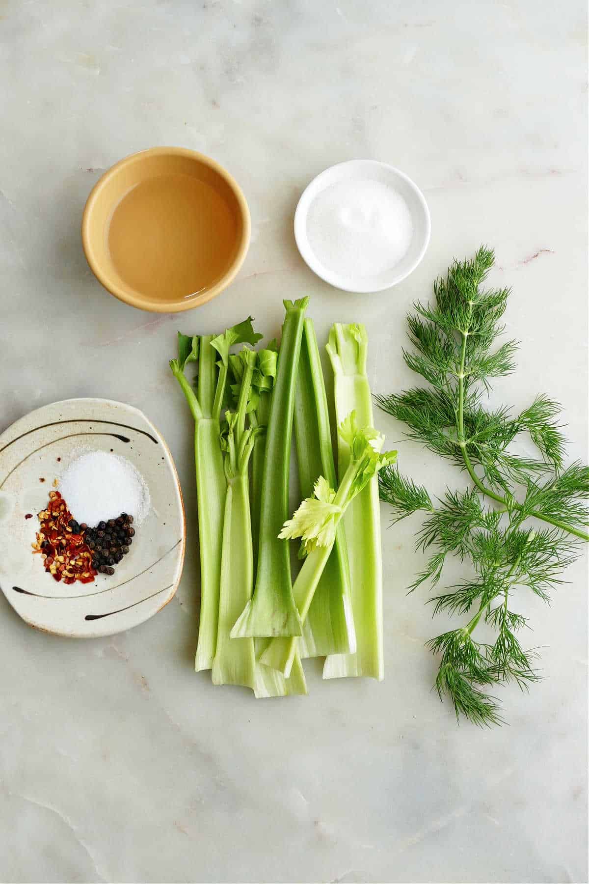 celery, vinegar, dill, sugar, salt, peppercorns, and red pepper flakes