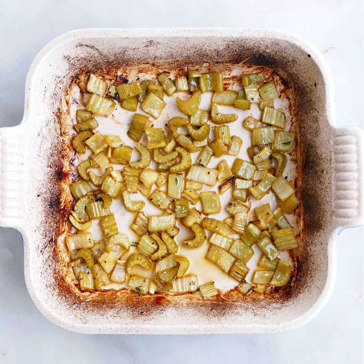 baked celery in a baking dish after coming out of the oven