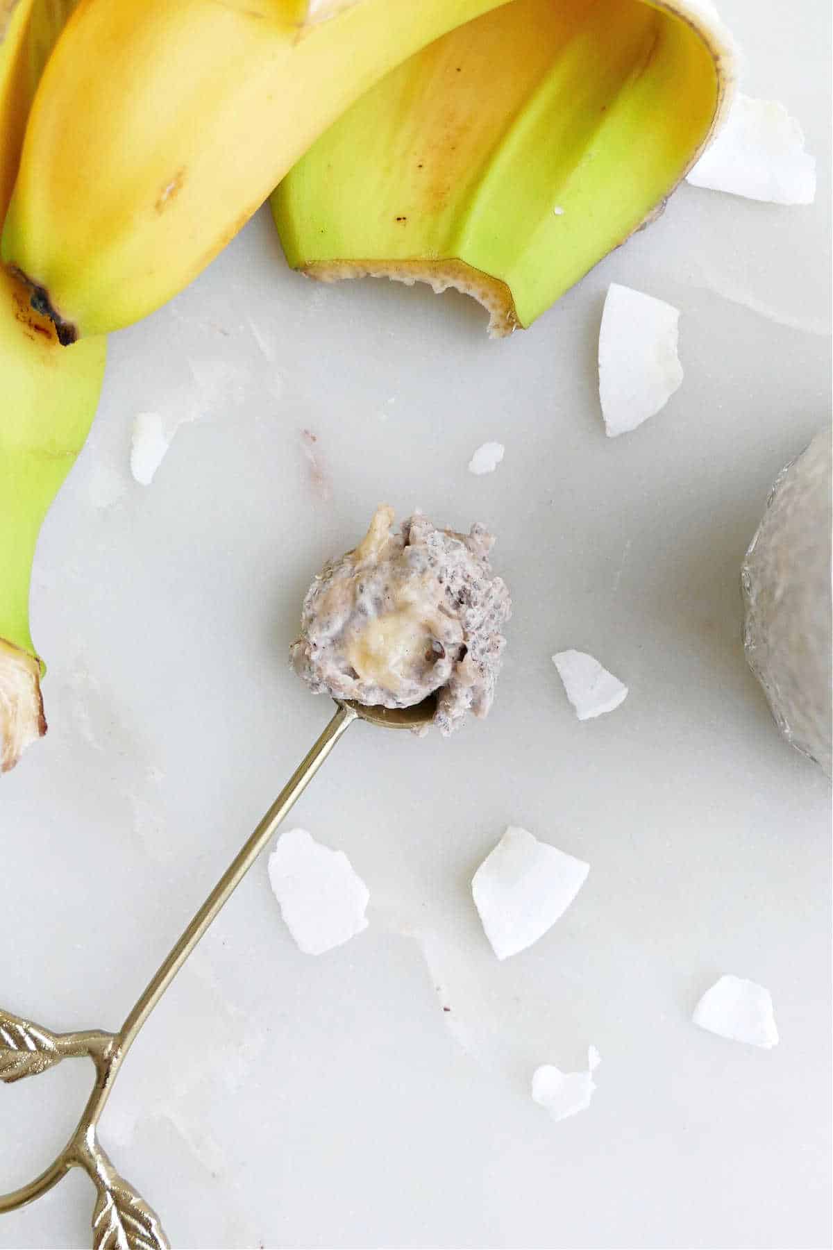 banana chia pudding on a spoon on a counter