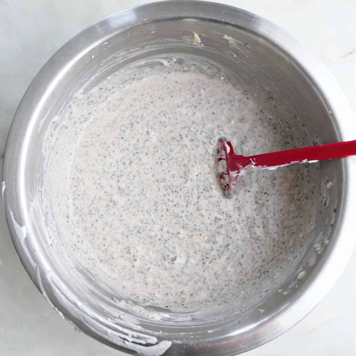 ingredients for chia pudding with bananas mixed together in a bowl