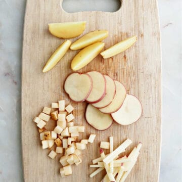 potato wedges, slices, cubes, and julienne pieces on a cutting board