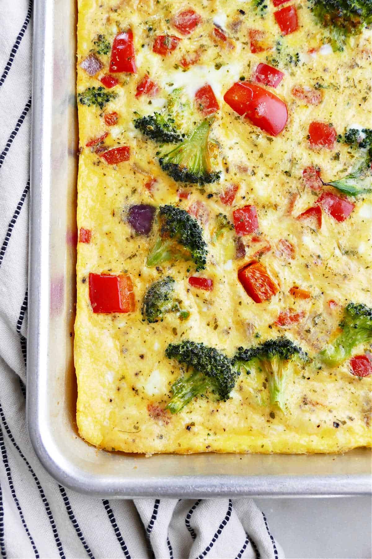 veggie omelet with cheese on a half sheet pan on top of a napkin