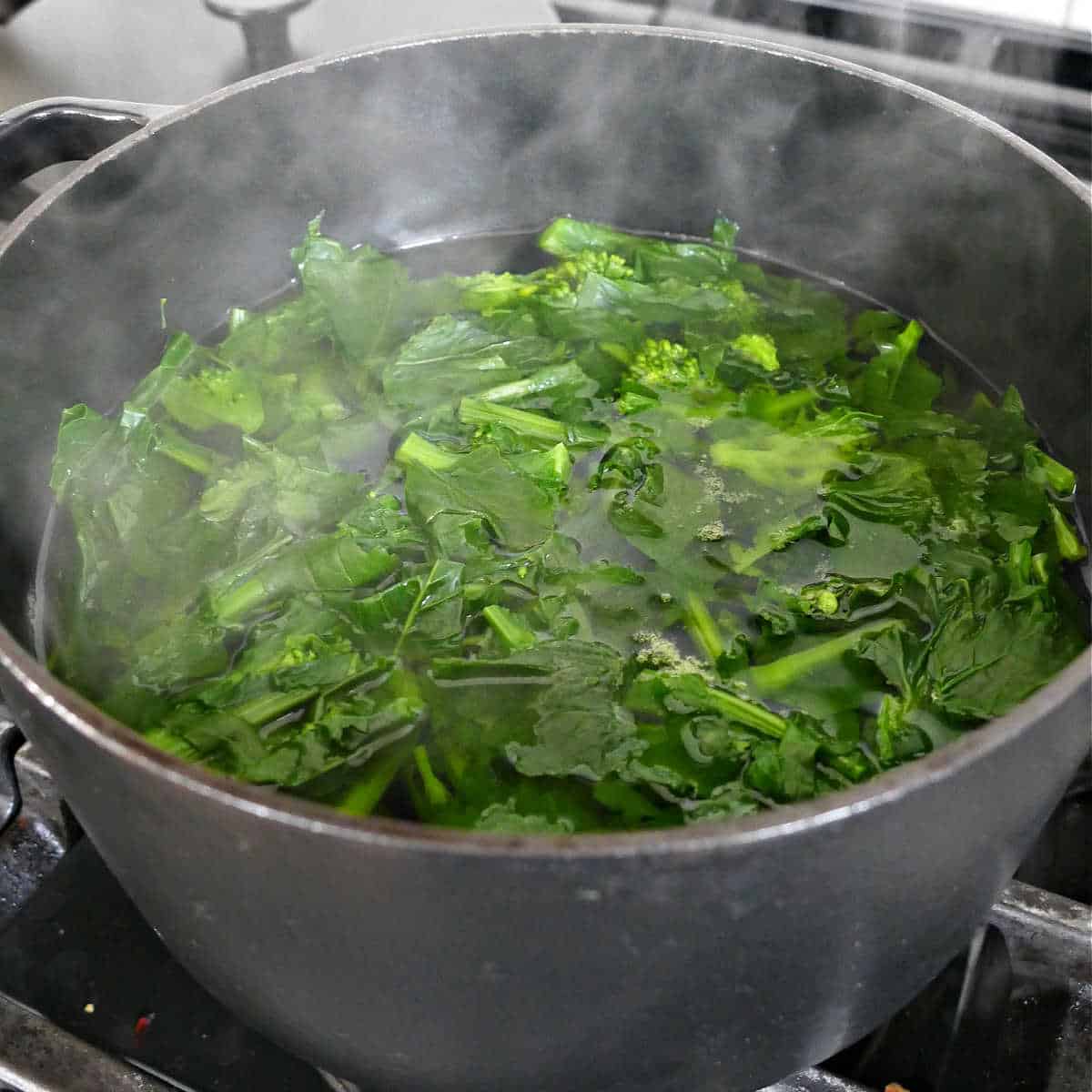 broccoli rabe cooking in boiling water in a large pot