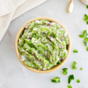 jalapeño relish in a small bowl next to ingredients and a napkin