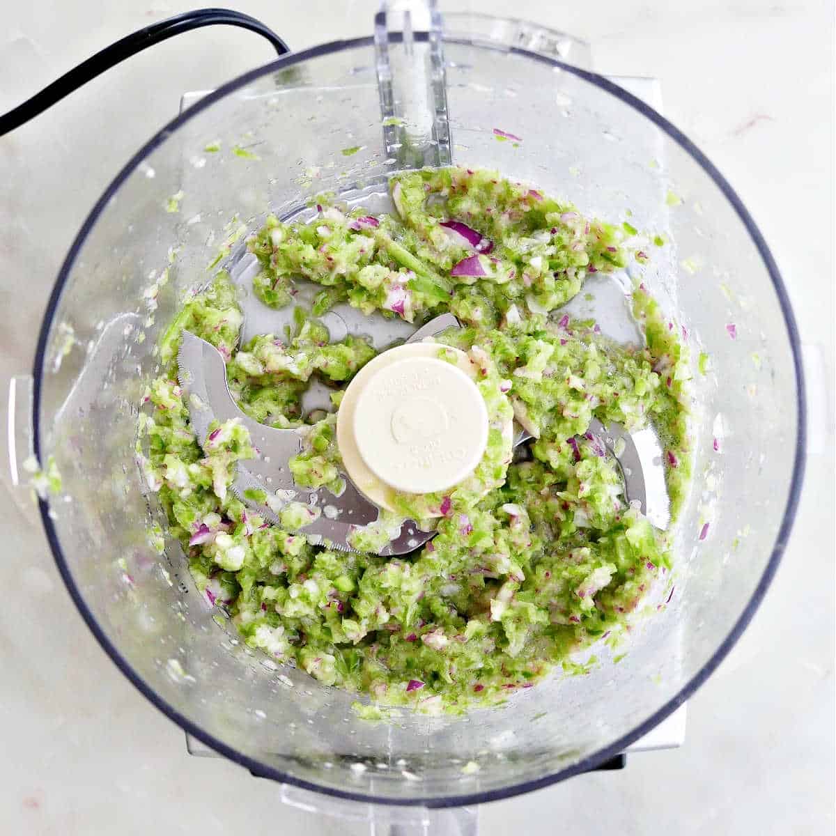 jalapeño relish pulsed in a food processor on a counter