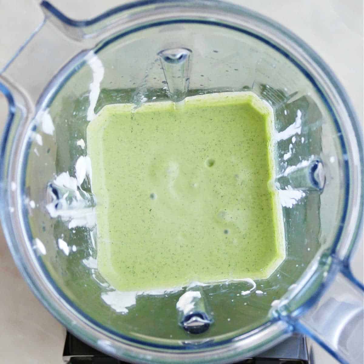 cilantro lime garlic sauce in a blender after being blended