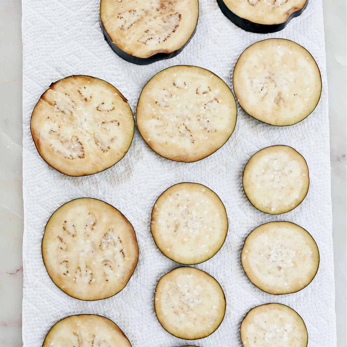 eggplant rounds sprinkled with salt and sweating on paper towels