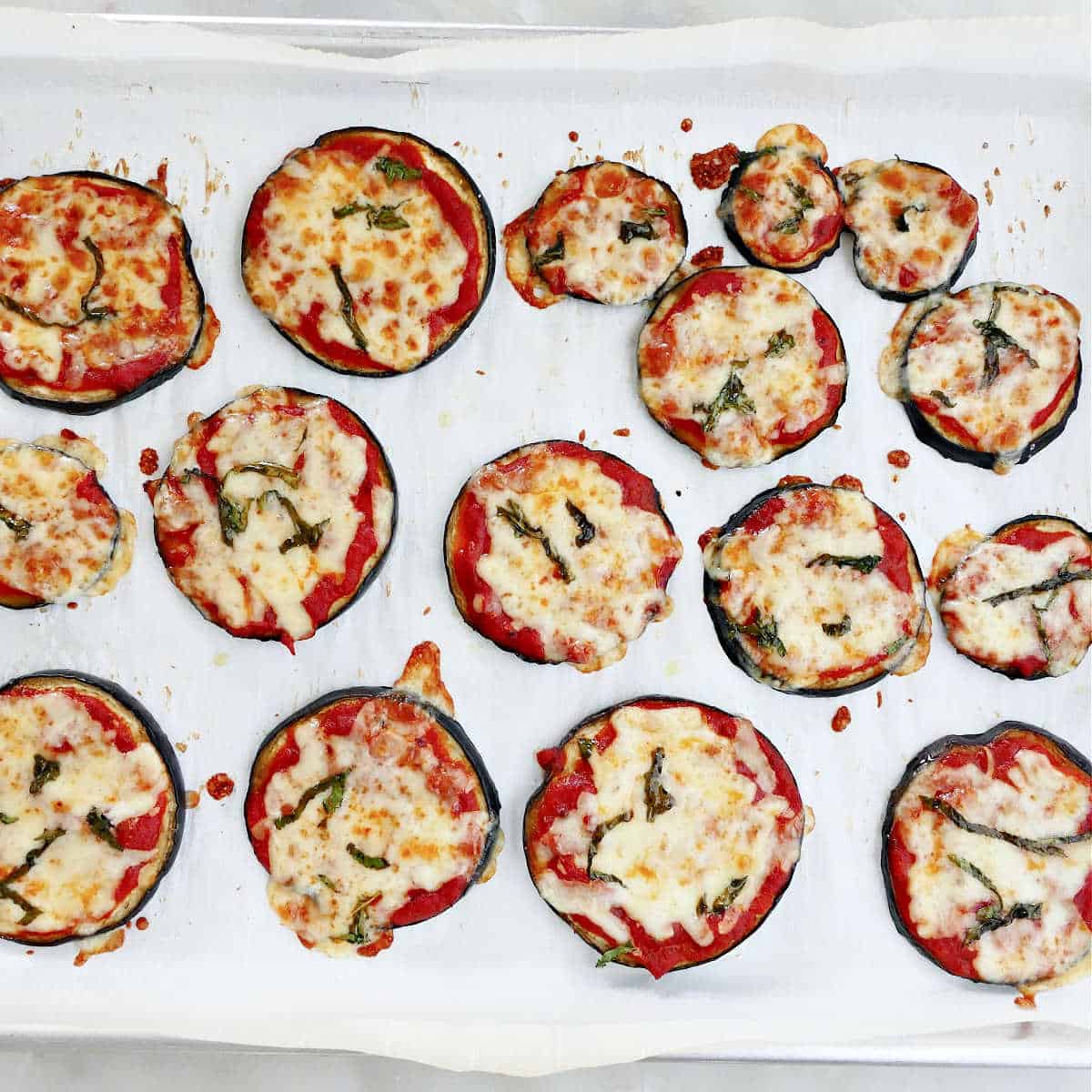 eggplant bites after being baked on a baking sheet