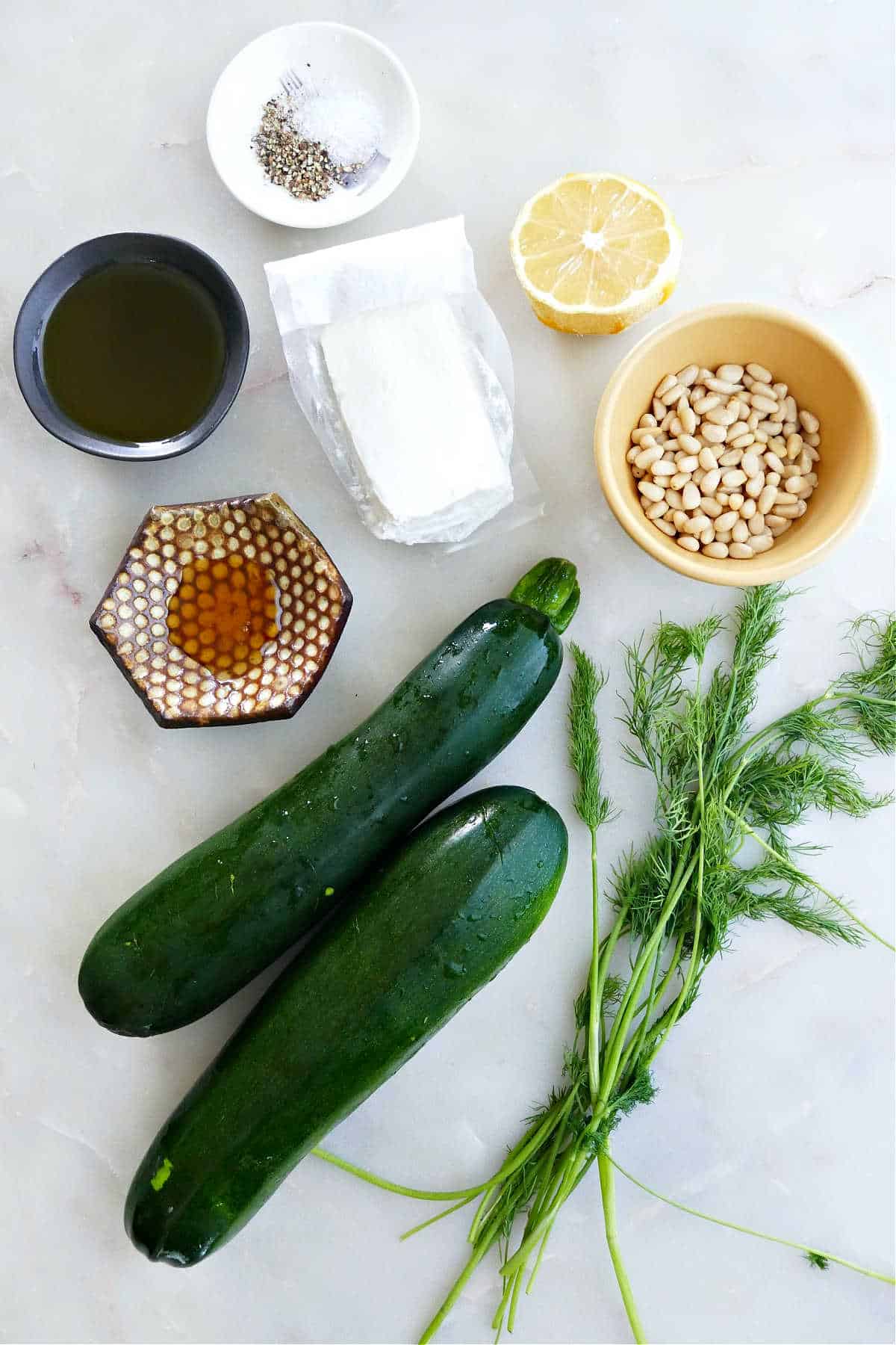 zucchini, dill, pine nuts, lemon, goat cheese, olive oil, honey, salt, and pepper