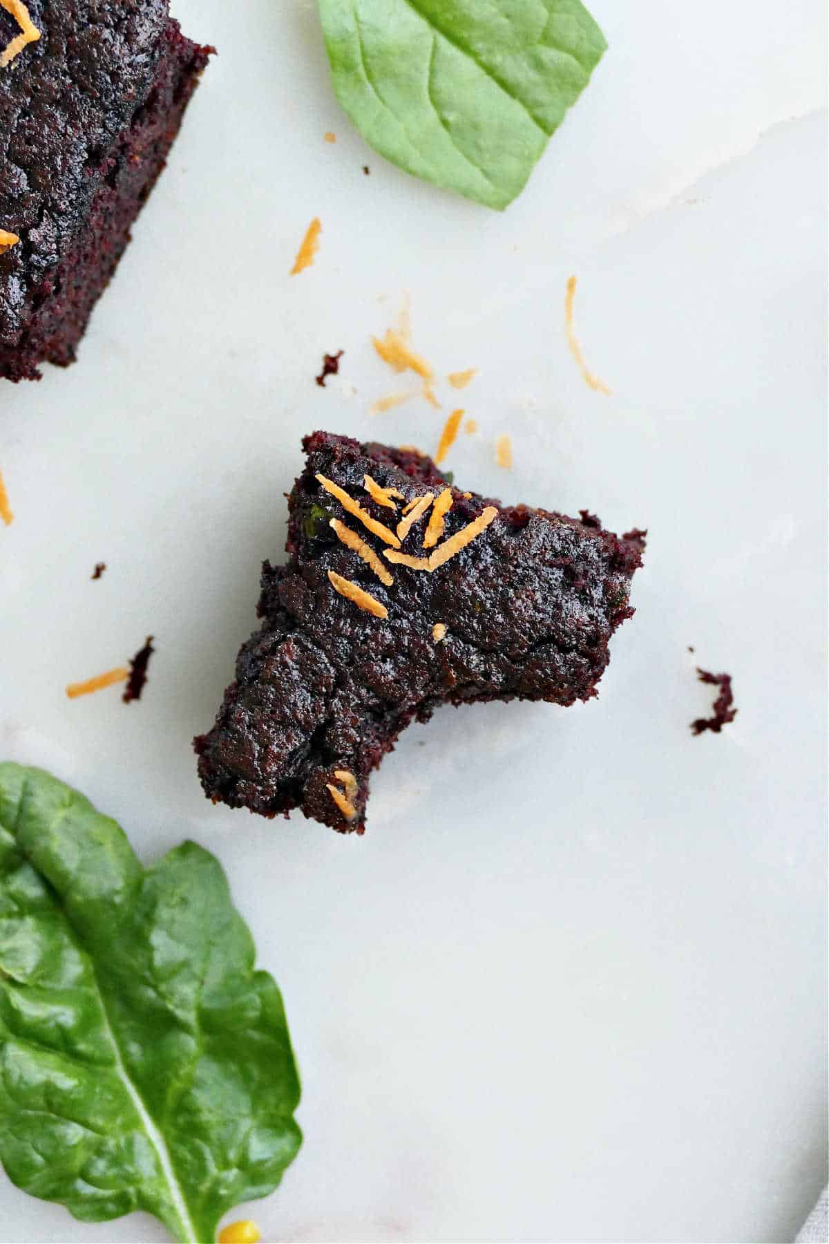 vegetable brownie with a bite taken out of it on a counter