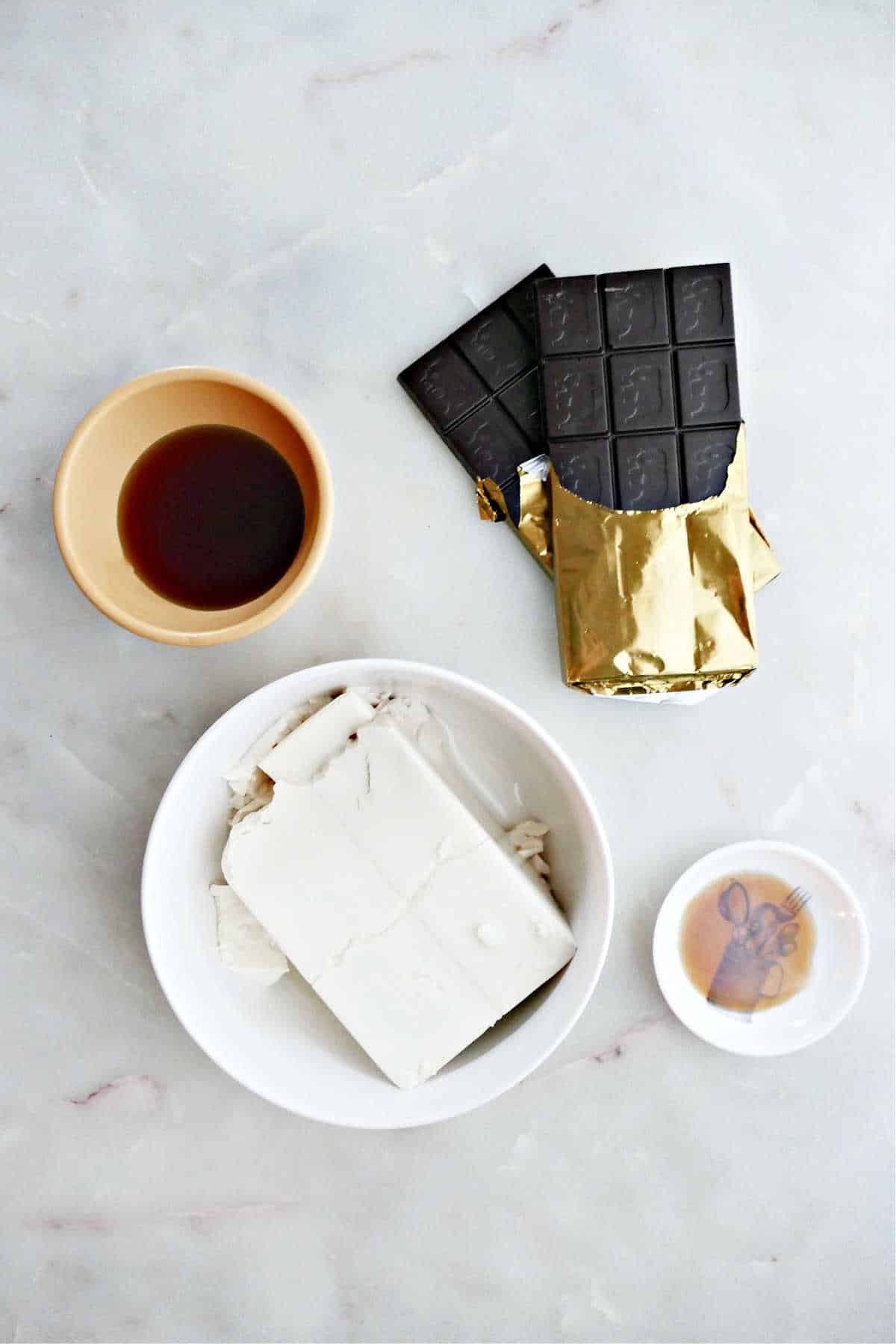 silken tofu, dark chocolate, maple syrup, and vanilla extract on a counter