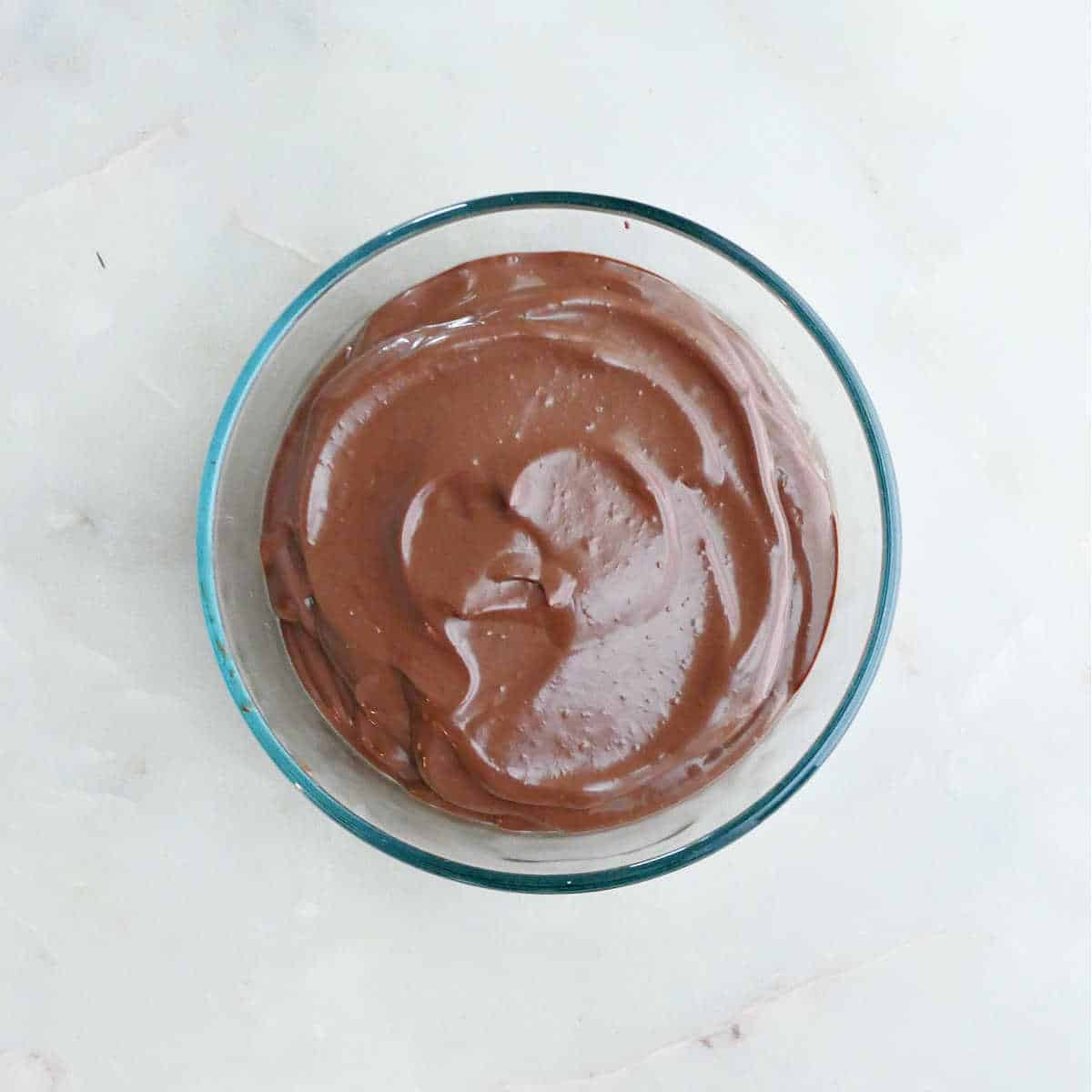 tofu chocolate mousse in a glass bowl on a counter before being chilled