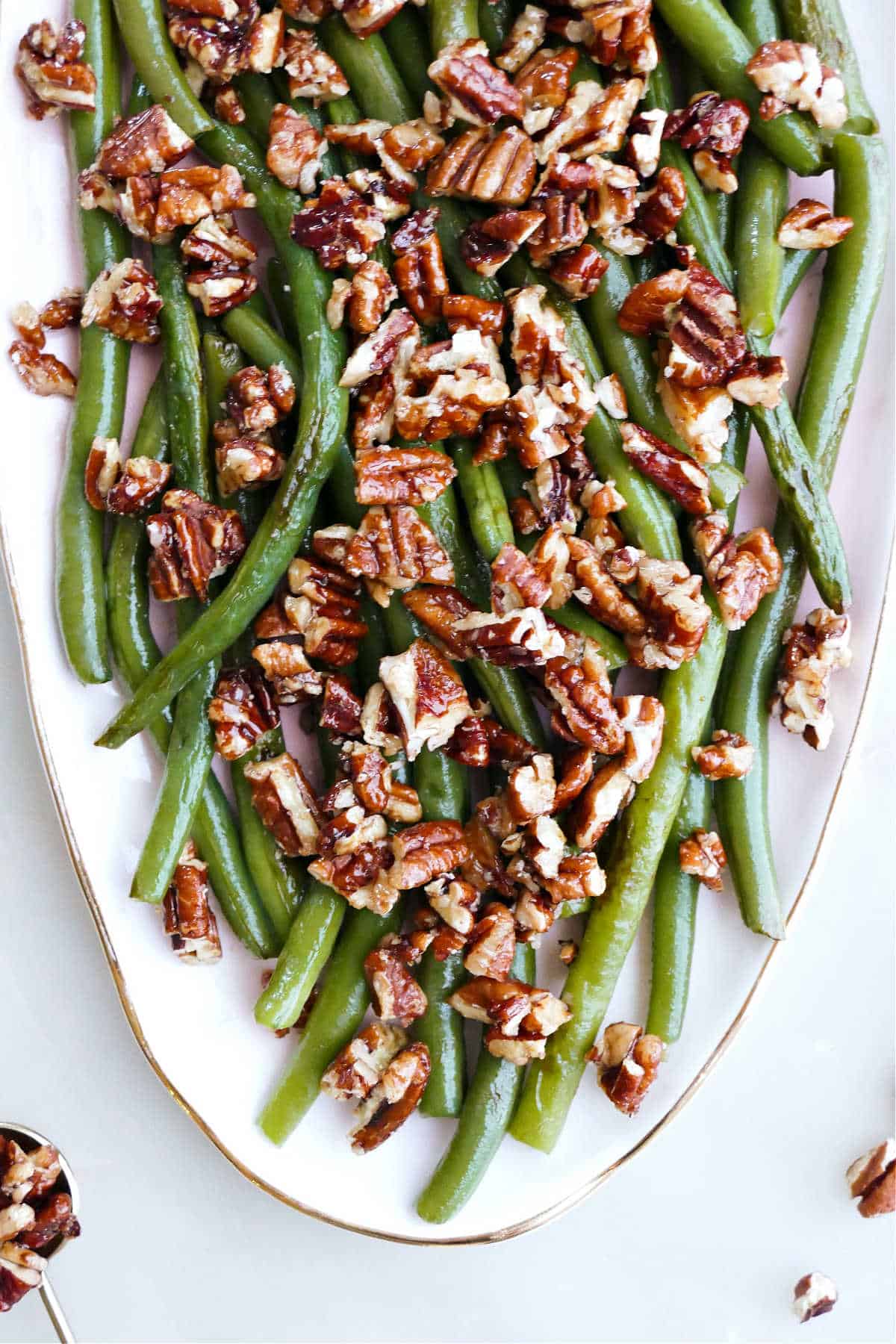 green beans with sweet and spicy pecans on a serving dish