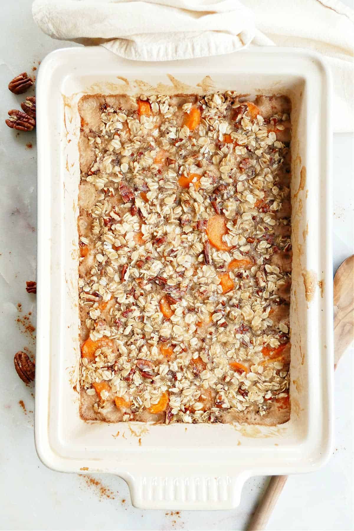 carrot casserole with oat topping in a baking dish on a counter