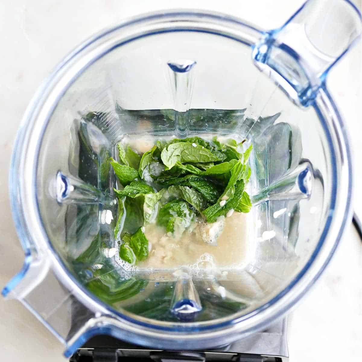 mint, tahini, maple syrup, garlic, and lemon juice in a blender