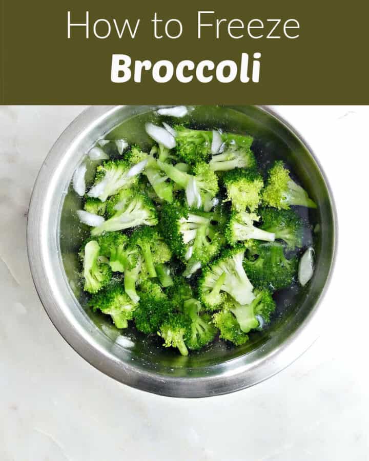blanched broccoli in a mixing bowl of ice water on a counter under text box for post name