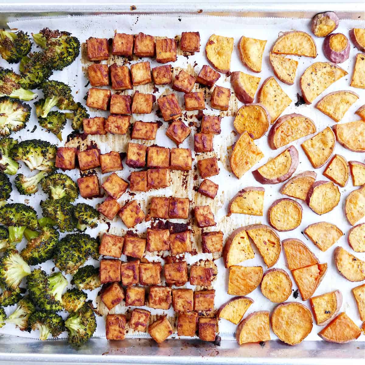 Sheet pan bbq marinated tofu with yams and broccoli after cooking.